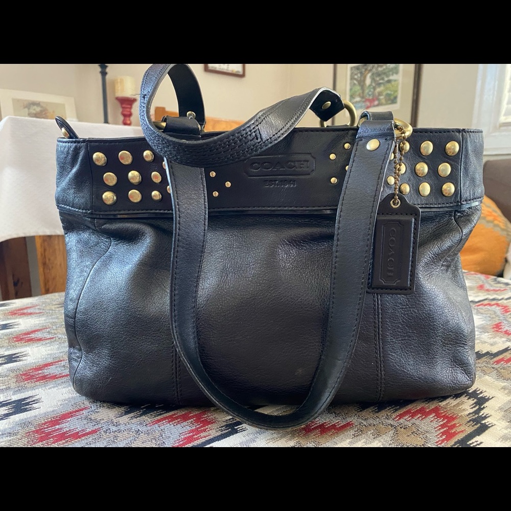 Coach black leather handbag with gold grommets